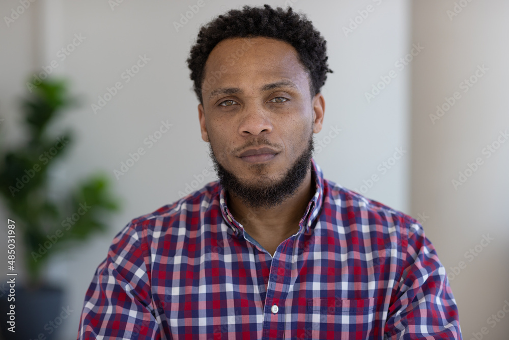 Black man serious face at home Black man serious face at home