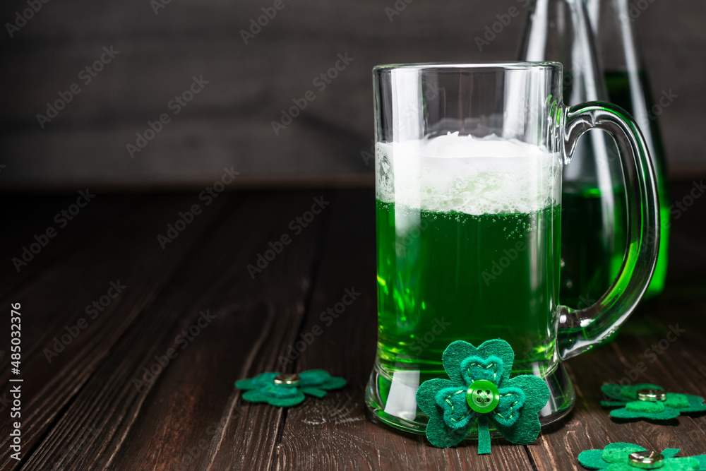 Green beer pint for Saint Patrick day on wooden table Green beer pint for Saint Patrick day on wooden table