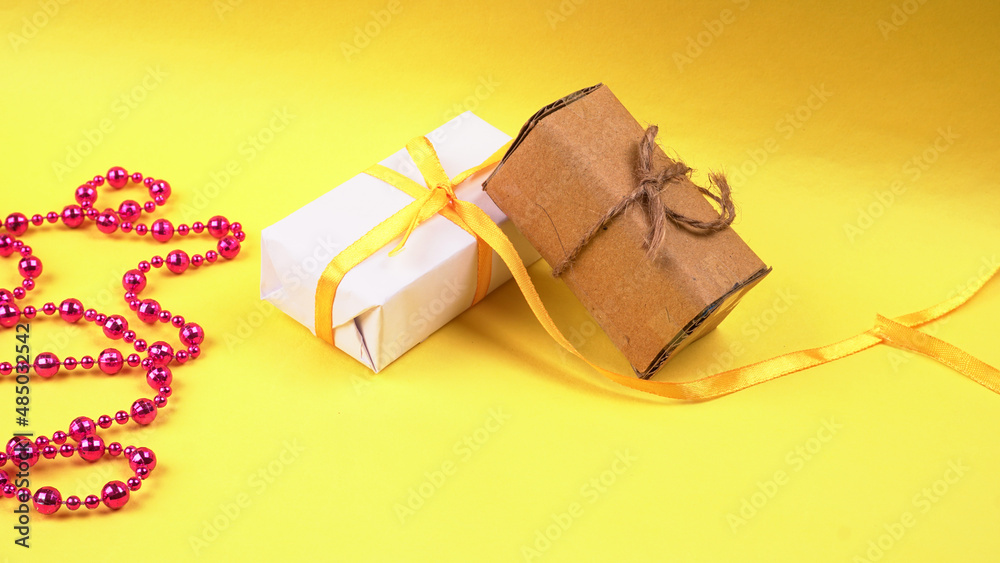 Gift box wrapping from craft paper the concept of handmade gift. Isolated background. Gift box wrapping from craft paper the concept of handmade gift. Isolated background.