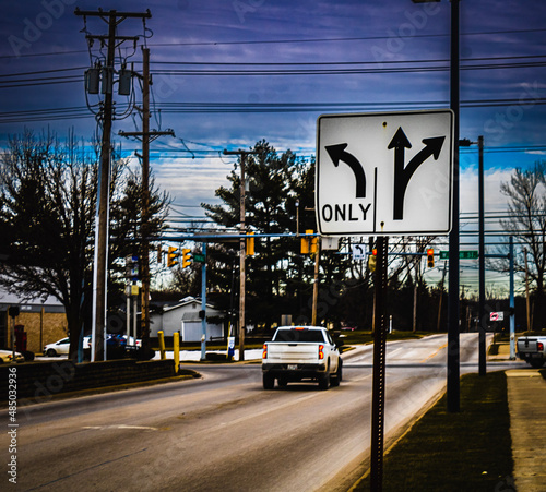 A  turning lane  traffic sign on the side of a road in Middlefield  Ohio