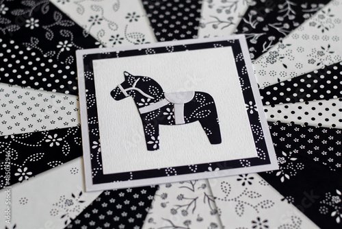 Handmade greeting card with Swedish Dala or Daleclarian horse floral folk pattern in black and white. photo