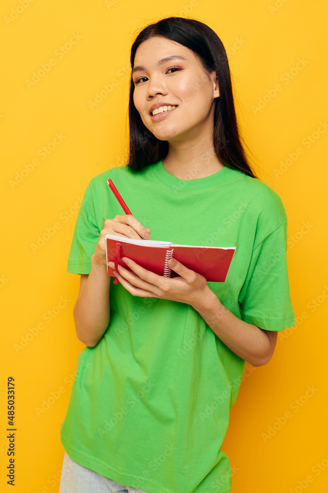 Portrait Asian beautiful young woman notebook and pen learning education Lifestyle unaltered Portrait Asian beautiful young woman notebook and pen learning education Lifestyle unaltered