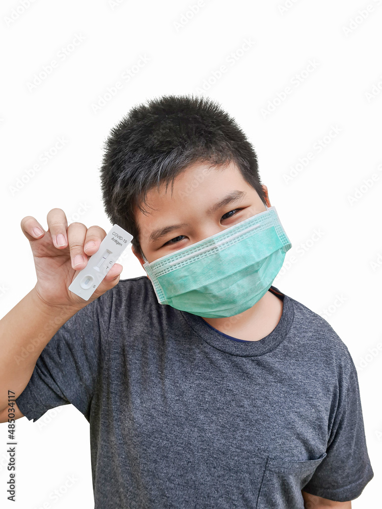 Boy showing off an infection tester Covid-19 with negative test result on a isolated white background