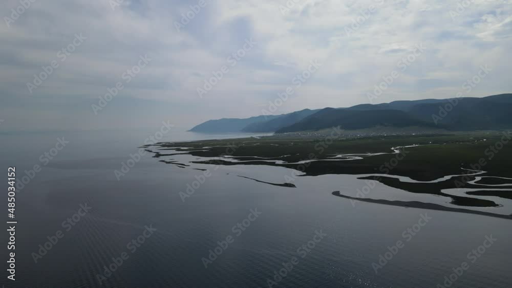 the picturesque mouth of the Goloustnaya river at different times of the year on the shores of Lake Baikal the picturesque mouth of the Goloustnaya river at different times of the year on the shores of Lake Baikal