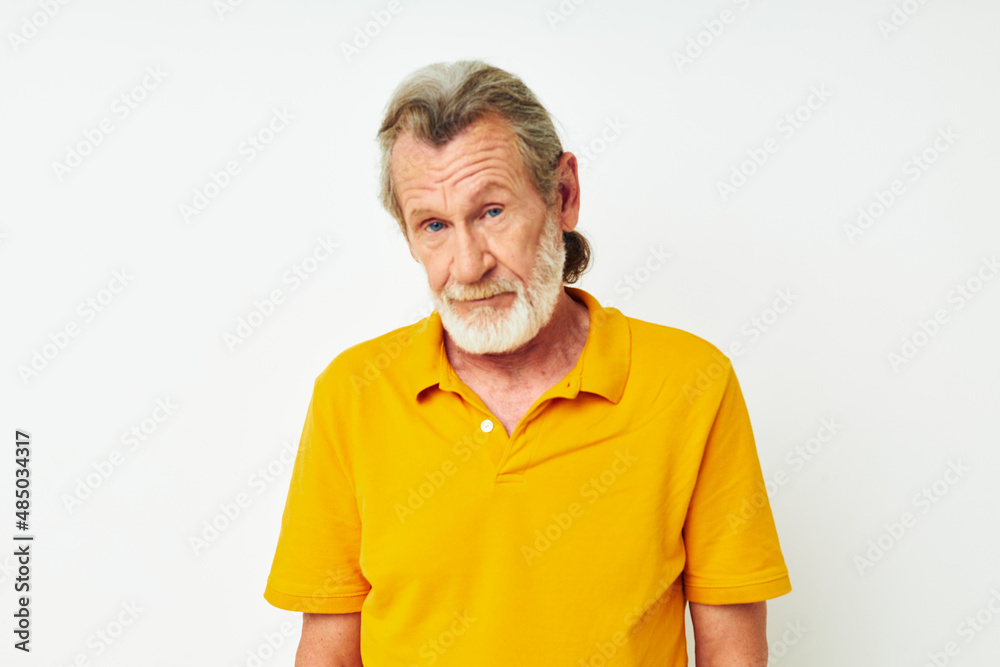 Portrait of happy senior man with a gray beard emotion gestures hands monochrome shot Portrait of happy senior man with a gray beard emotion gestures hands monochrome shot