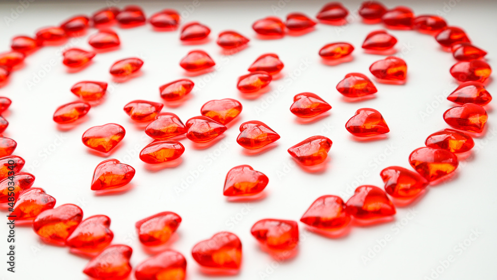 Heart of small red hearts on a white background, close-up. The concept of holidays and Valentine's Day Heart of small red hearts on a white background, close-up. The concept of holidays and Valentine's Day