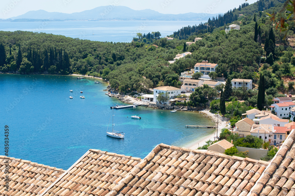Beautiful bay with beach in Kalami village, Corfu island, Greece. Panoramic top view of beautiful mediterranean landscape