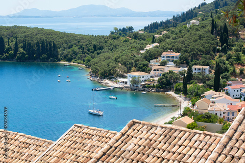 Beautiful bay with beach in Kalami village, Corfu island, Greece. Panoramic top view of beautiful mediterranean landscape photo