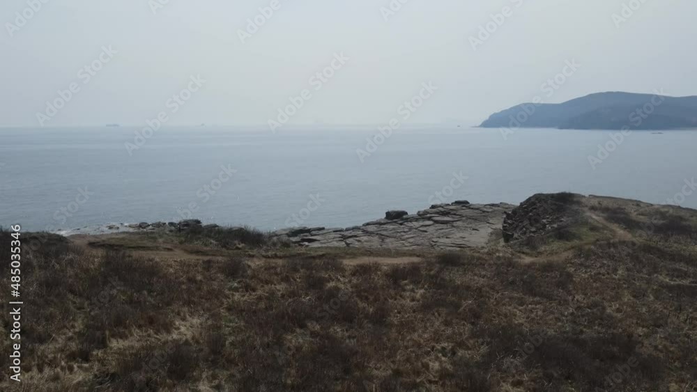 cliffs of Cape Tobizina on Russky Island cliffs of Cape Tobizina on Russky Island