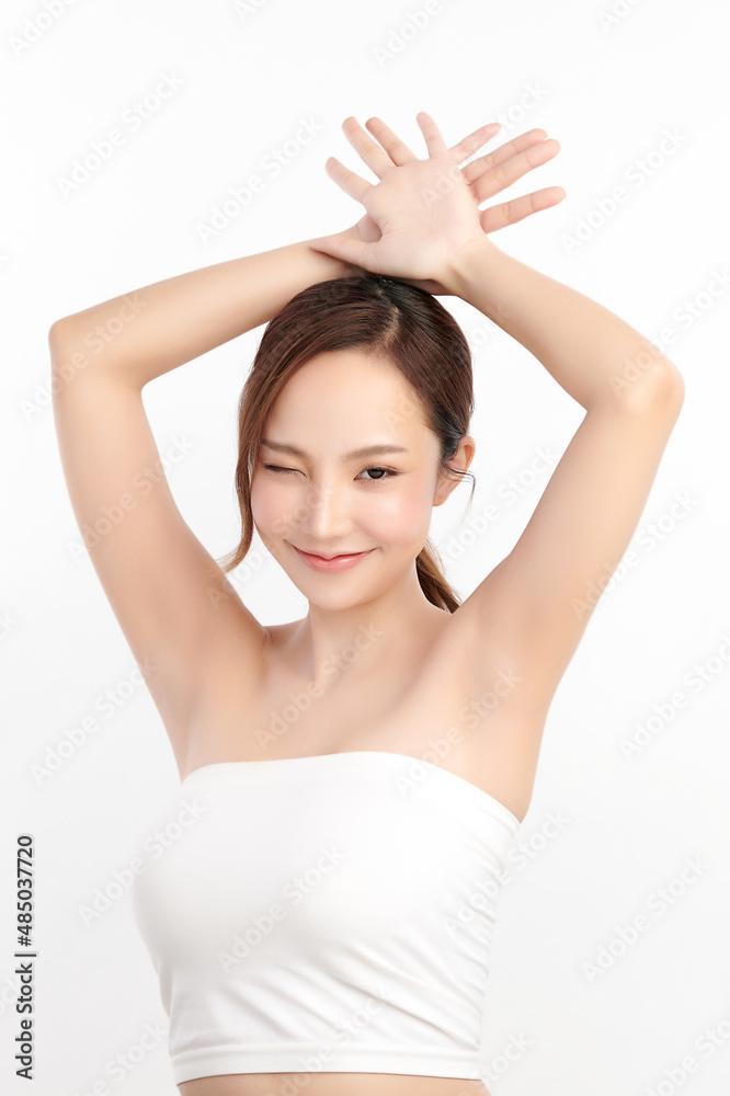 Beautiful Young Asian woman lifting hands up to show off clean and hygienic armpits or underarms on white background, Smooth armpit cleanliness and protection concept Beautiful Young Asian woman lifting hands up to show off clean and hygienic armpits or underarms on white background, Smooth armpit cleanliness and protection concept