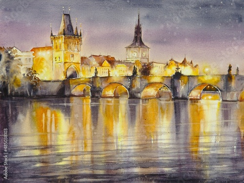 Photography Charles Bridge at night with lights reflecting and illuminating in Vltava River, Prague, Czech Republic