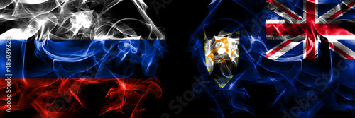 Russia, Russian vs British, Britain, Anguilla flags. Smoke flag placed side by side isolated on black background