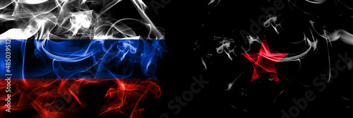 Russia, Russian vs EZLN and the Neozapatista ideology flags. Smoke flag placed side by side isolated on black background photo