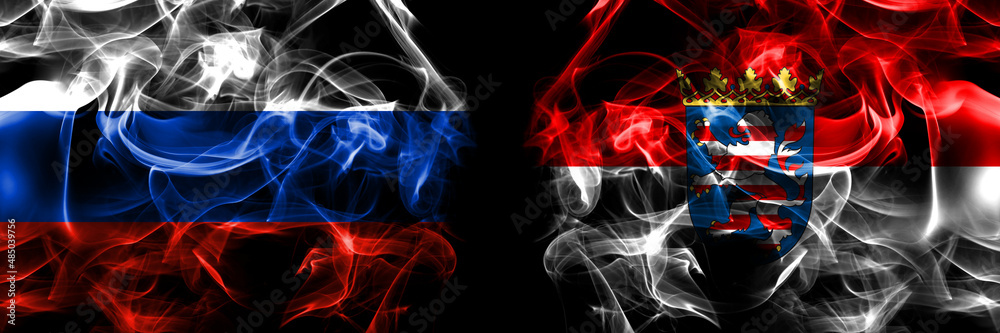 Russia, Russian vs Germany, Hesse, state, region flags. Smoke flag placed side by side isolated on black background