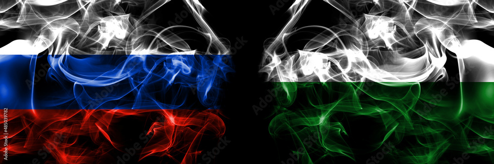 Russia, Russian vs Germany, Saxony flags. Smoke flag placed side by side isolated on black background