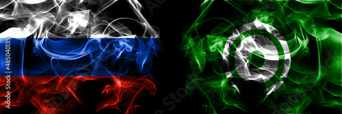 Russia, Russian vs Japan, Japanese, Kyogoku, Hokkaido, Shiribeshi, Subprefecture flags. Smoke flag placed side by side isolated on black background photo