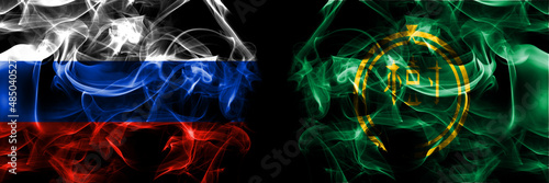 Russia, Russian vs Japan, Japanese, Taiki, Hokkaido, Tokachi, Subprefecture flags. Smoke flag placed side by side isolated on black background photo