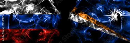 Russia, Russian vs Marshall Islands flags. Smoke flag placed side by side isolated on black background