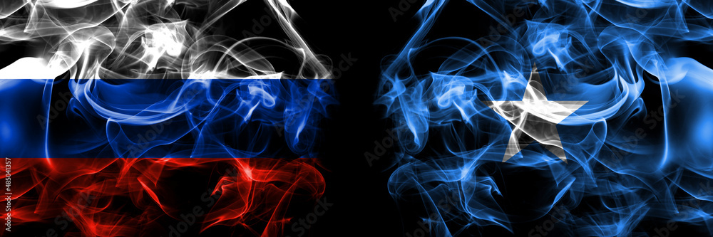 Russia, Russian vs Somalia, Somali flags. Smoke flag placed side by side isolated on black background