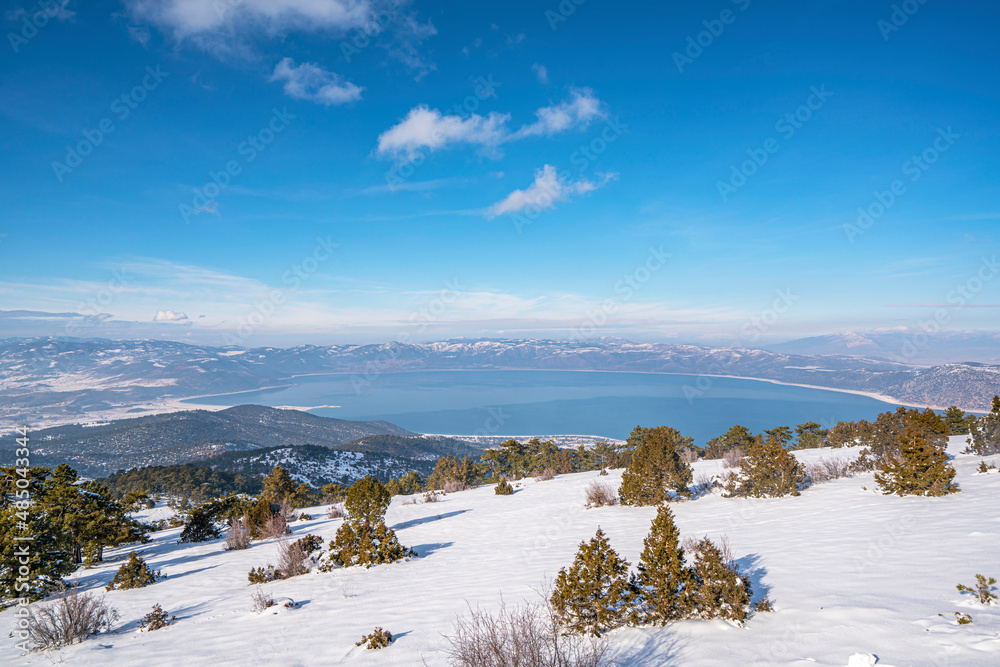 Naklejka premium Scenic views from Salda lake with snow at the Salda ski center which is famous with lake which has white sand, glassy turquoise water. 