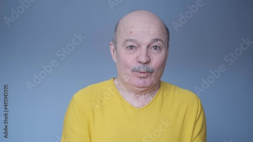 Senior caucasian man scared and amazed with open mouth for surprise