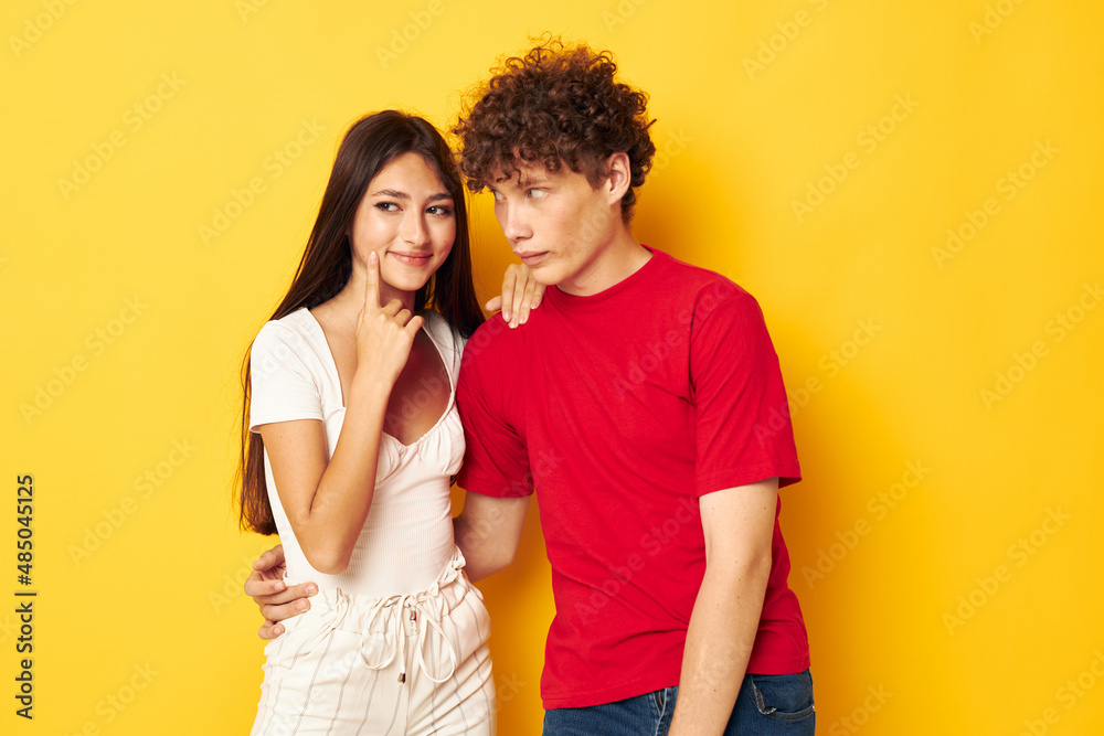 cute young couple together posing emotions close-up yellow background unaltered cute young couple together posing emotions close-up yellow background unaltered
