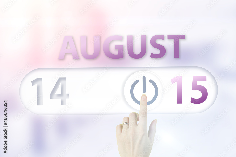 Fototapeta premium August 15th. Day 15 of month, Calendar date.Hand finger switches pointing calendar date on sunlight office background. Summer month, day of the year concept.