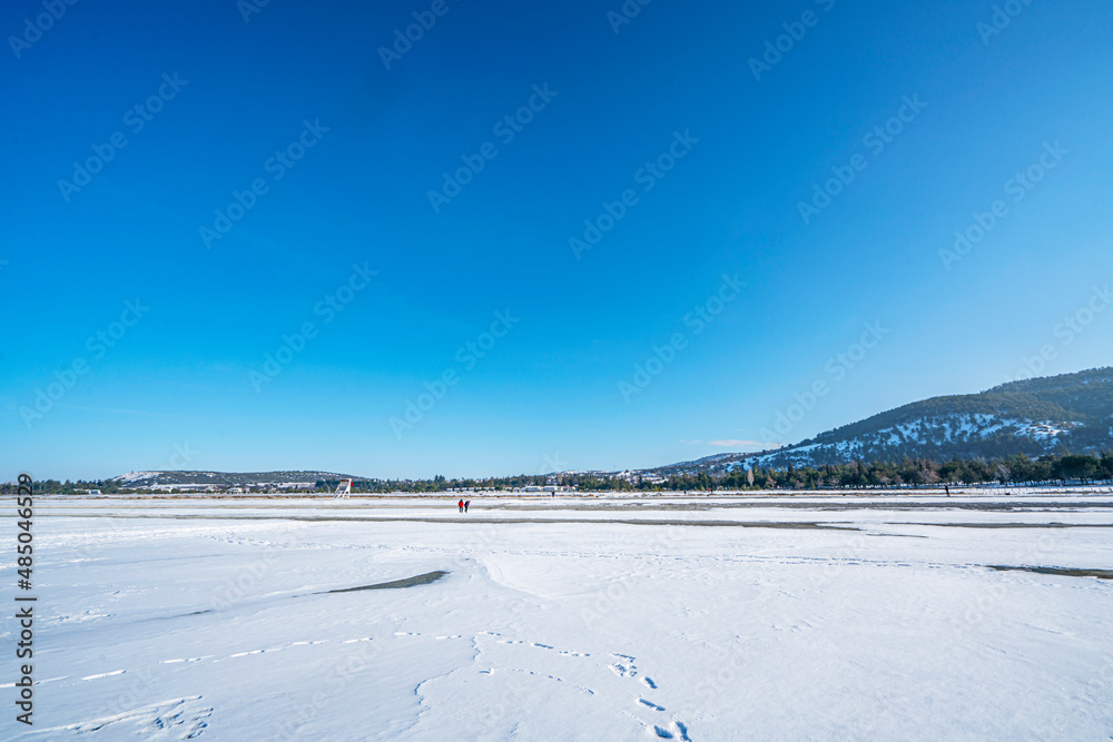 Scenic views of Salda lake in winter which is  famous with white sand, glassy turquoise water, Burdur, Turkey