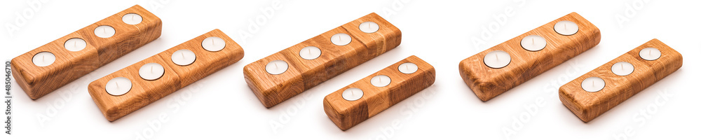 Set of tealight candlesticks isolated on a white background. Wooden oak candlestick. Set of tealight candlesticks isolated on a white background. Wooden oak candlestick.