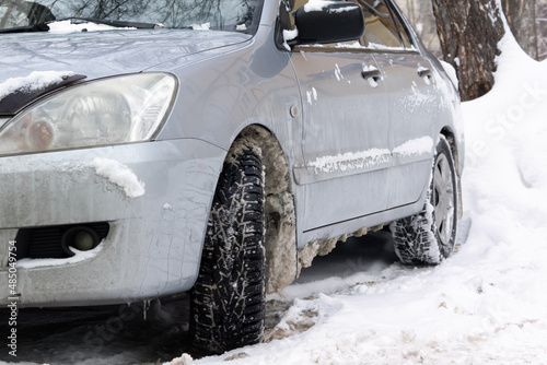 car in the parking lot after a snowfall