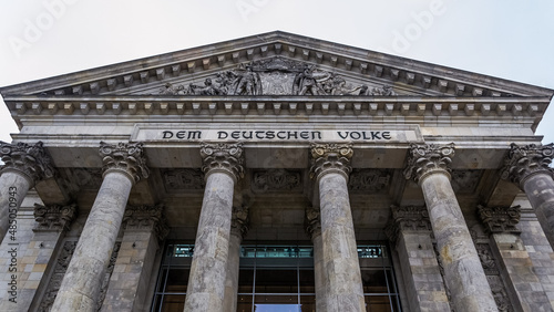 Architectural detail of the frontal part of the Reichstag, a historic building in the city of Berlin which houses the Bundestag, the lower house of Germany's parliament