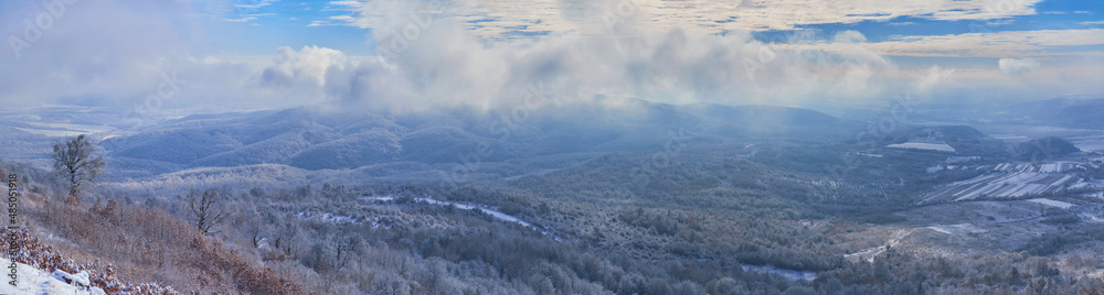 Panorama of the winter landscape. View from the top of Mount Borlug in Transcarpathia, Ukraine