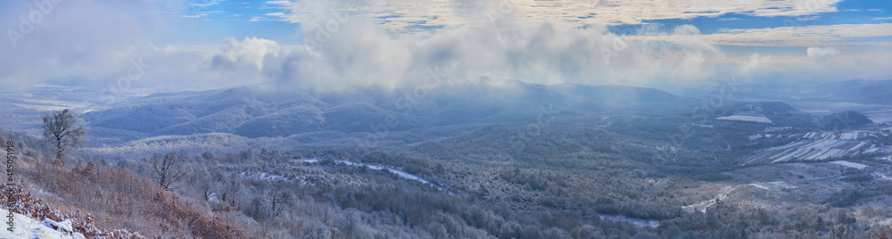 Panorama of the winter landscape. View from the top of Mount Borlug in Transcarpathia, Ukraine Panorama of the winter landscape. View from the top of Mount Borlug in Transcarpathia, Ukraine