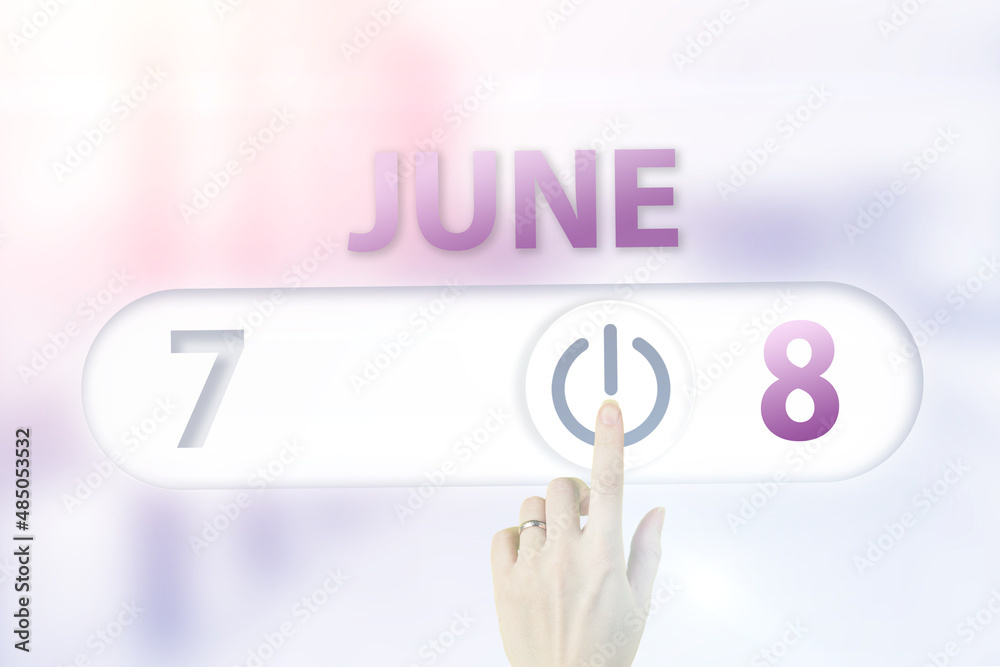 June 8th. Day 8 of month, Calendar date.Hand finger switches pointing calendar date on sunlight office background. Summer month, day of the year concept. June 8th. Day 8 of month, Calendar date.Hand finger switches pointing calendar date on sunlight office background. Summer month, day of the year concept.