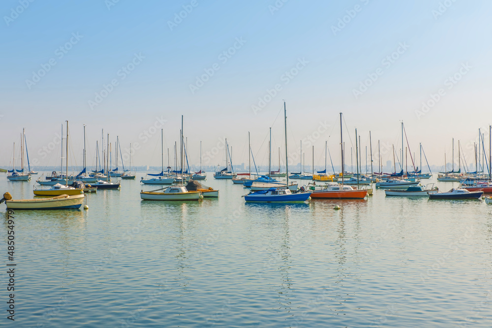 Boats anchored in a calm, peaceful harbour