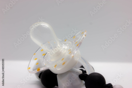 black baby pacifier on a white background