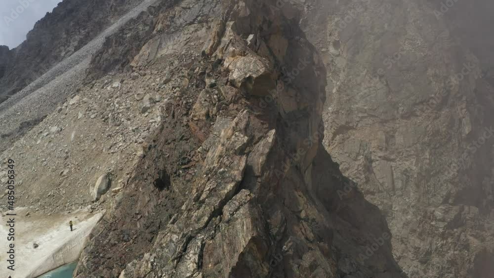 Sharp mountain range aerial view. Steep rocky ridge landscape. High quality 4k footage Sharp mountain range aerial view. Steep rocky ridge landscape. High quality 4k footage