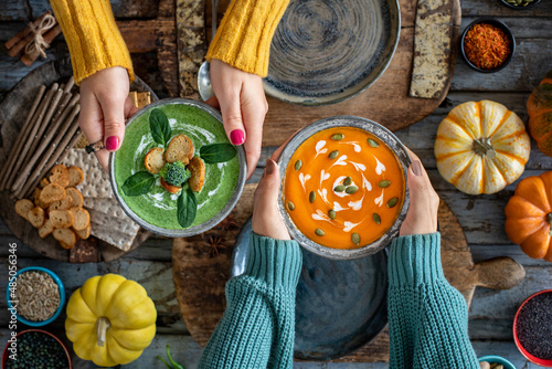 Two women drinking their vegetable soups