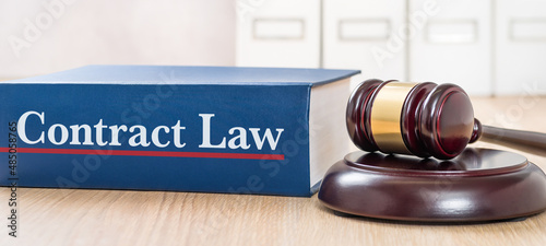 A law book with a gavel - Contract law photo