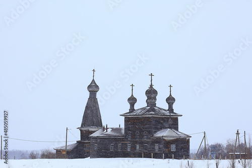 wooden church in the Russian north landscape in winter, architecture historical religion Christianity photo