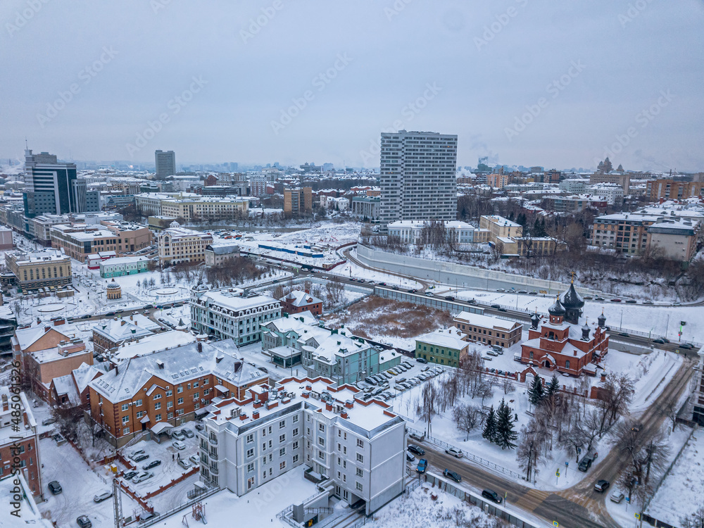 View of the center of Kazan from above. High-rise buildings, churches and historic buildings. Winter View
