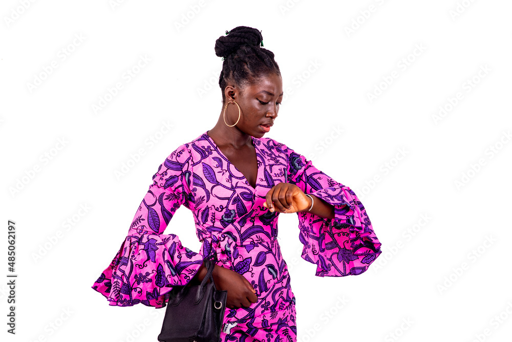 beautiful young businesswoman looking at the time on her wrist watch. beautiful young businesswoman looking at the time on her wrist watch.
