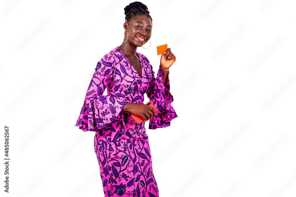 beautiful young businesswoman holding credit card and mobile phone smiling. beautiful young businesswoman holding credit card and mobile phone smiling.