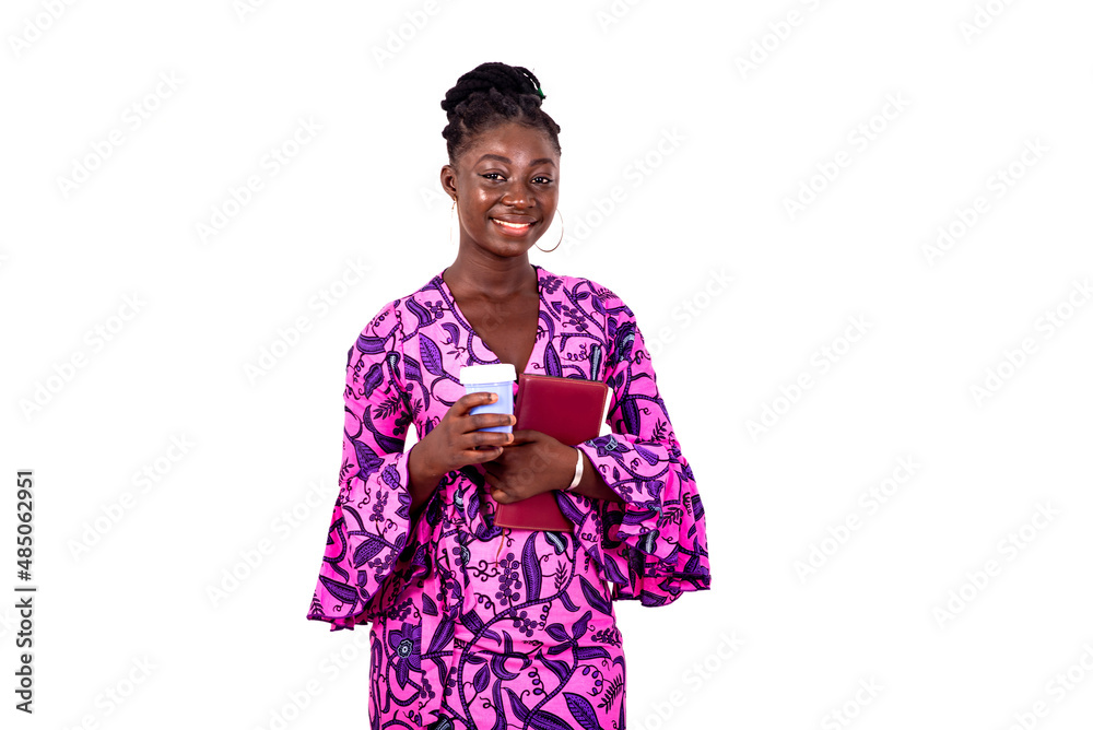 beautiful young businesswoman holding a notebook and a cup of coffee. beautiful young businesswoman holding a notebook and a cup of coffee.