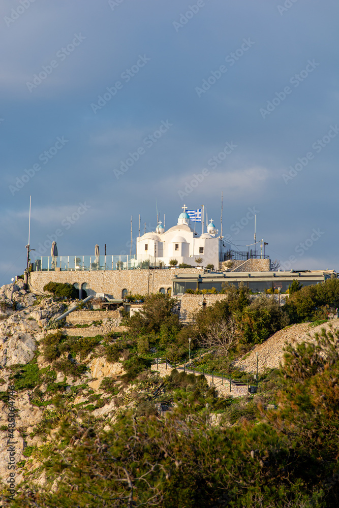 Athenian Church of St. George on Lycabettus against a dramatic sky, cityscape