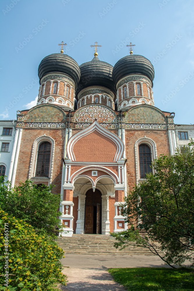 Black domed red brick building of the Cathedral of the Intercession of the Most Holy Theotokos built in 1671 on Izmailovo Island near the residence of the House of Romanov in Moscow, Russia
