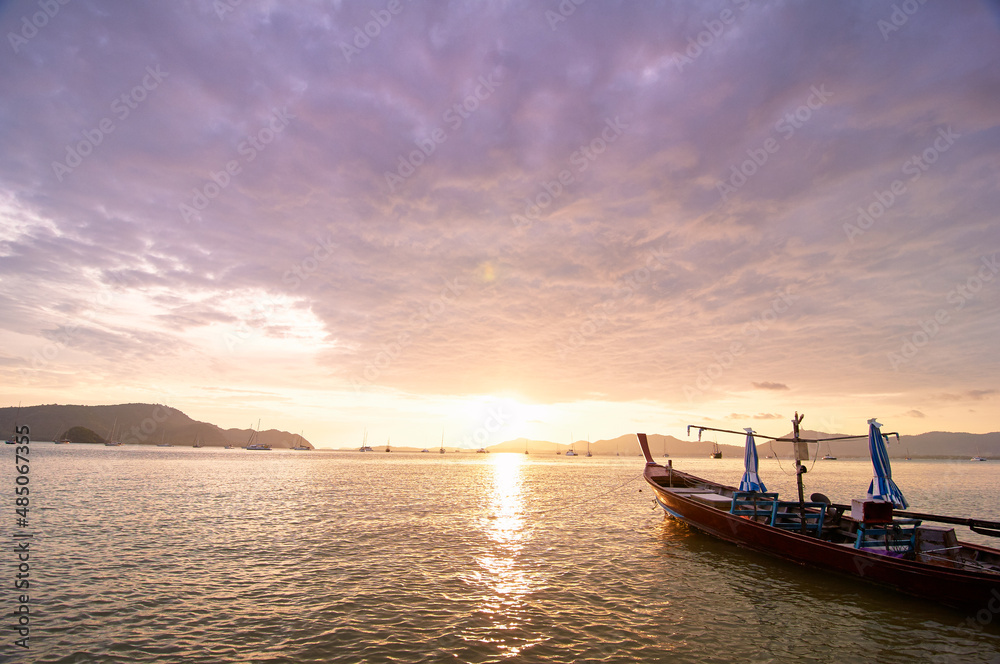 Travel in Thailand. Colorful landscape with sea beach, traditional longtail boat over beautiful sunset background. Travel in Thailand. Colorful landscape with sea beach, traditional longtail boat over beautiful sunset background.