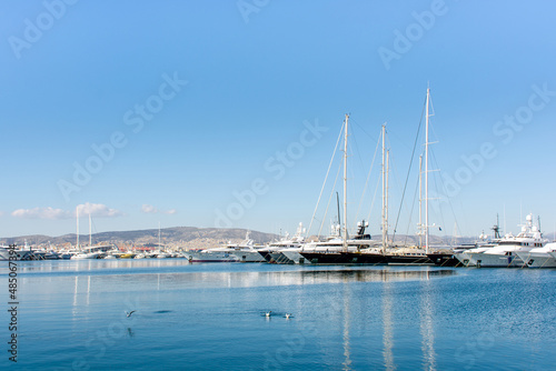 Beautiful yachts on the pier against the blue sky  Athens embankment