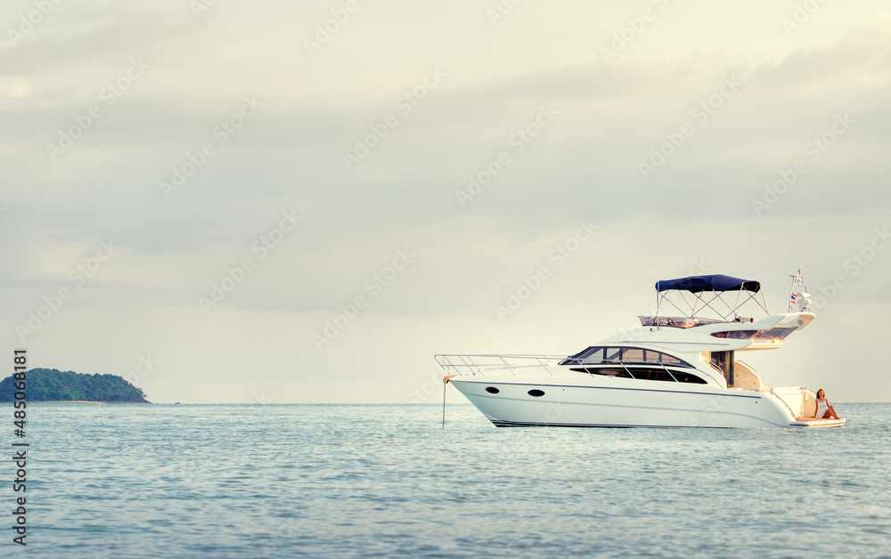 White modern motor yacht sailing the sea