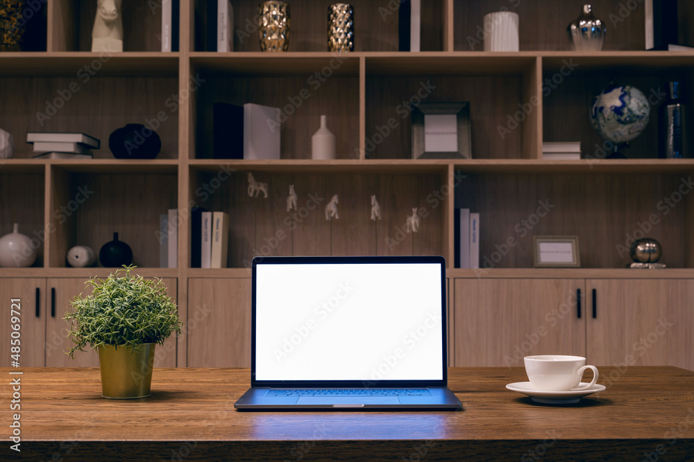 Laptop with white screen on the table. Work from home. Laptop with white screen on the table. Work from home.